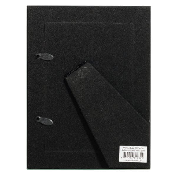 Black ring binder and notebook on dark surface